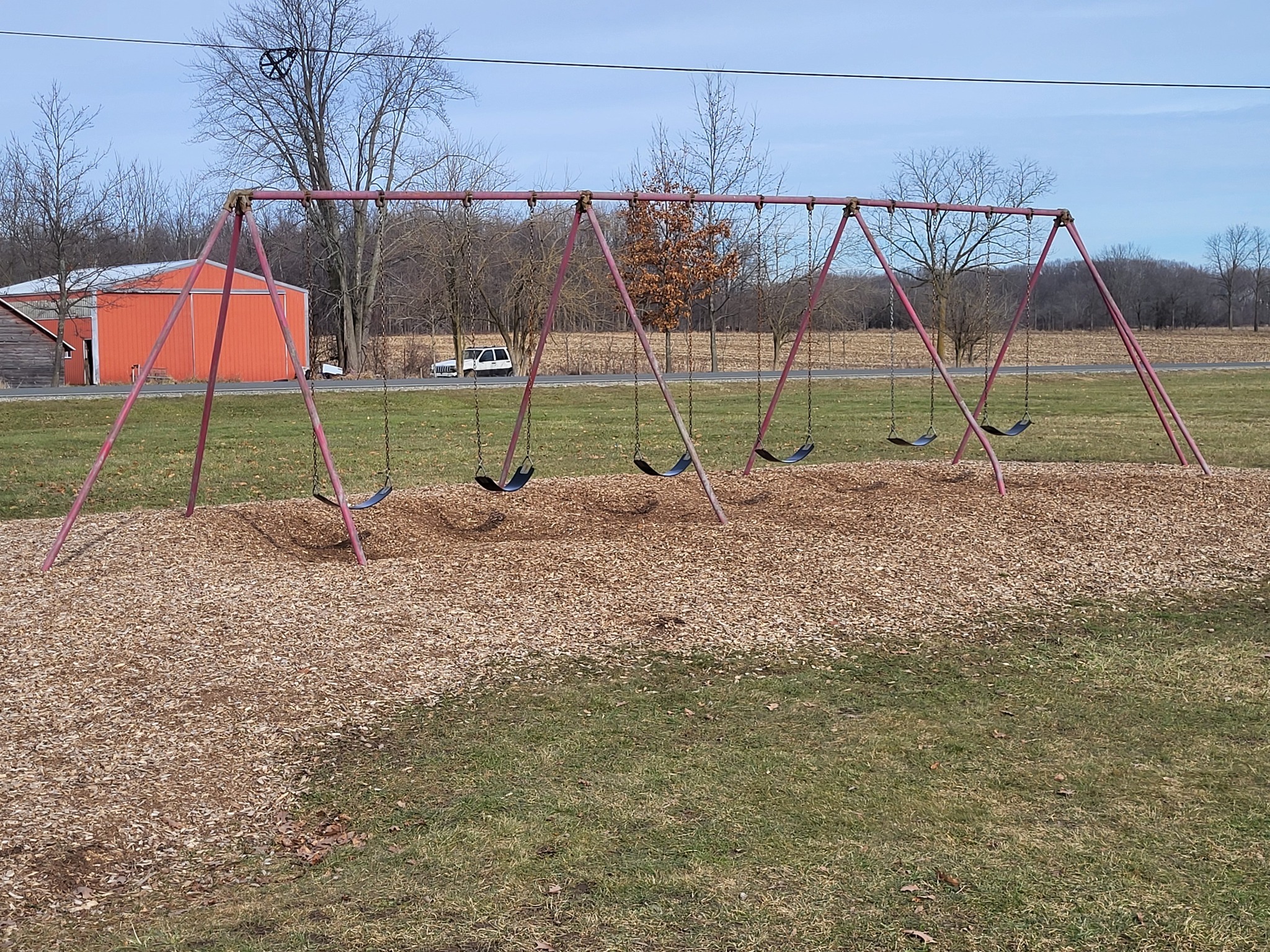 Photo of aging swings at elementary playground